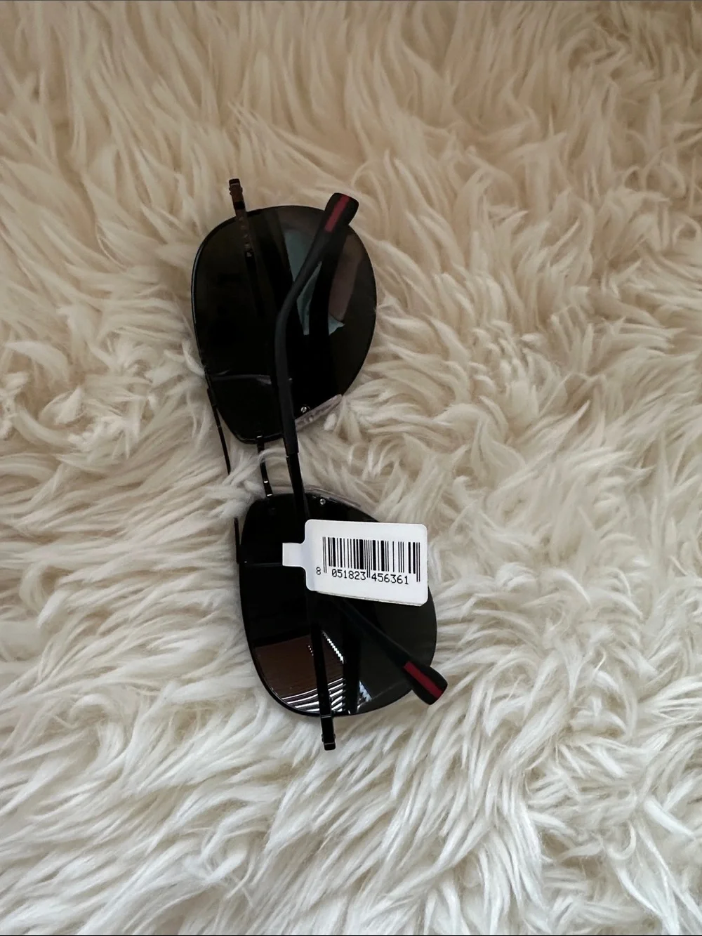 Prada Men’s Black and Silver Rimless Sunglasses